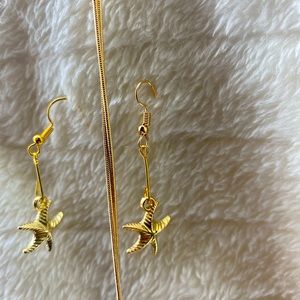 Starfish and butterfly shaped gold and silver earrings with necklaces.